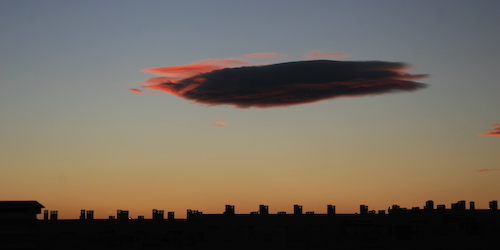 Cloud at dusk over the skyline of Alicante, Spain.