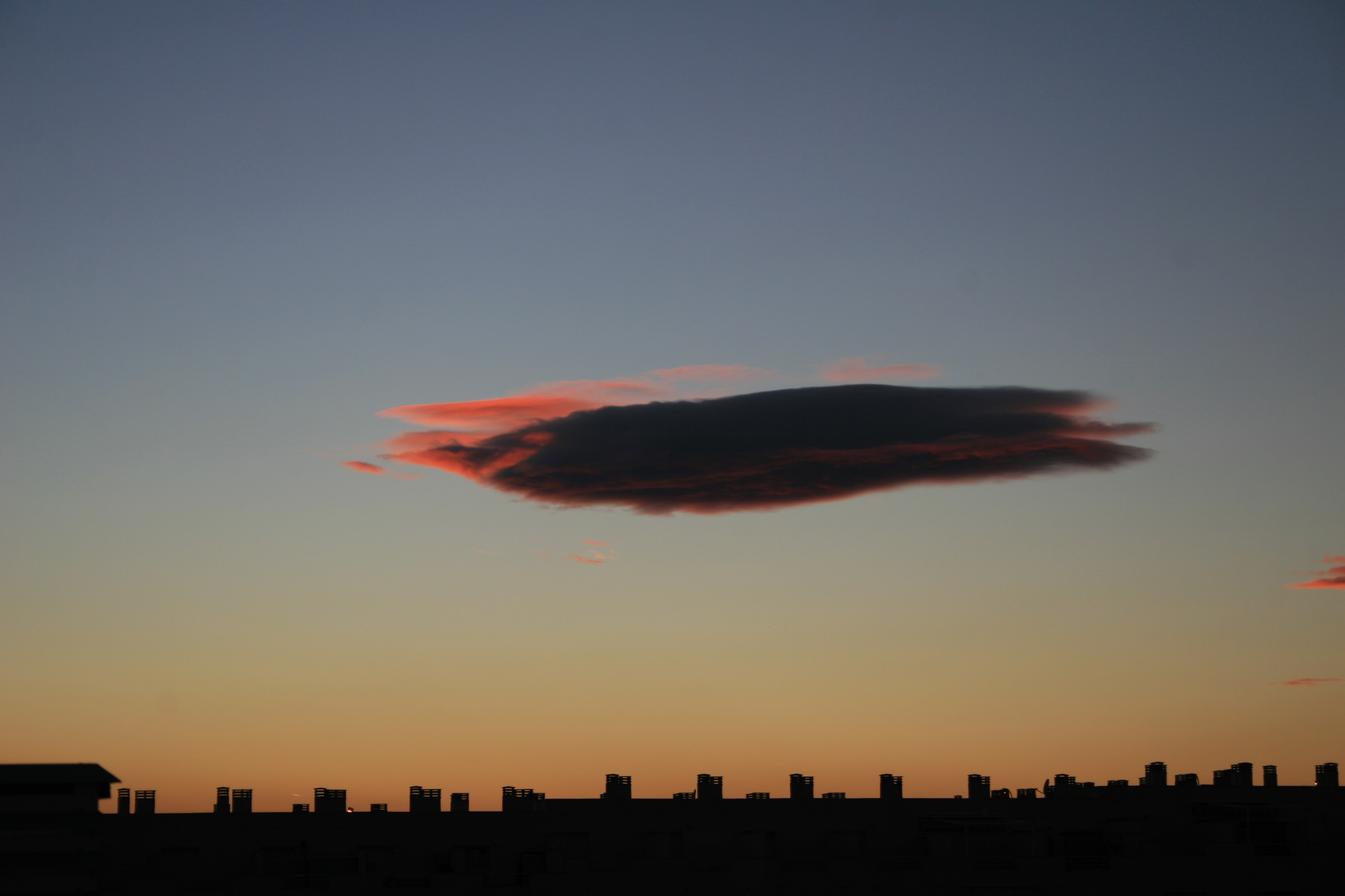 Cloud at dusk over the skyline of Alicante, Spain.
